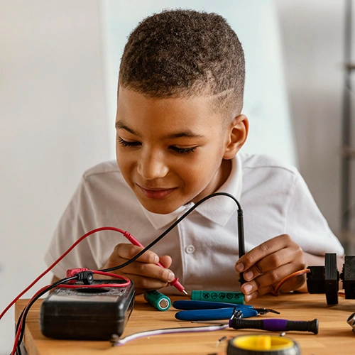 Child learning electronics and robotics